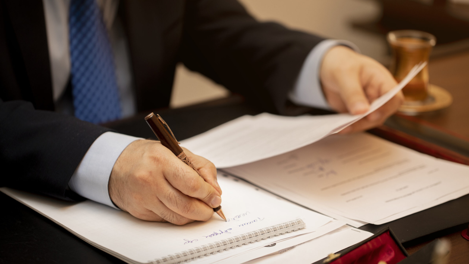 Businessman signing important contract papers. High quality photo